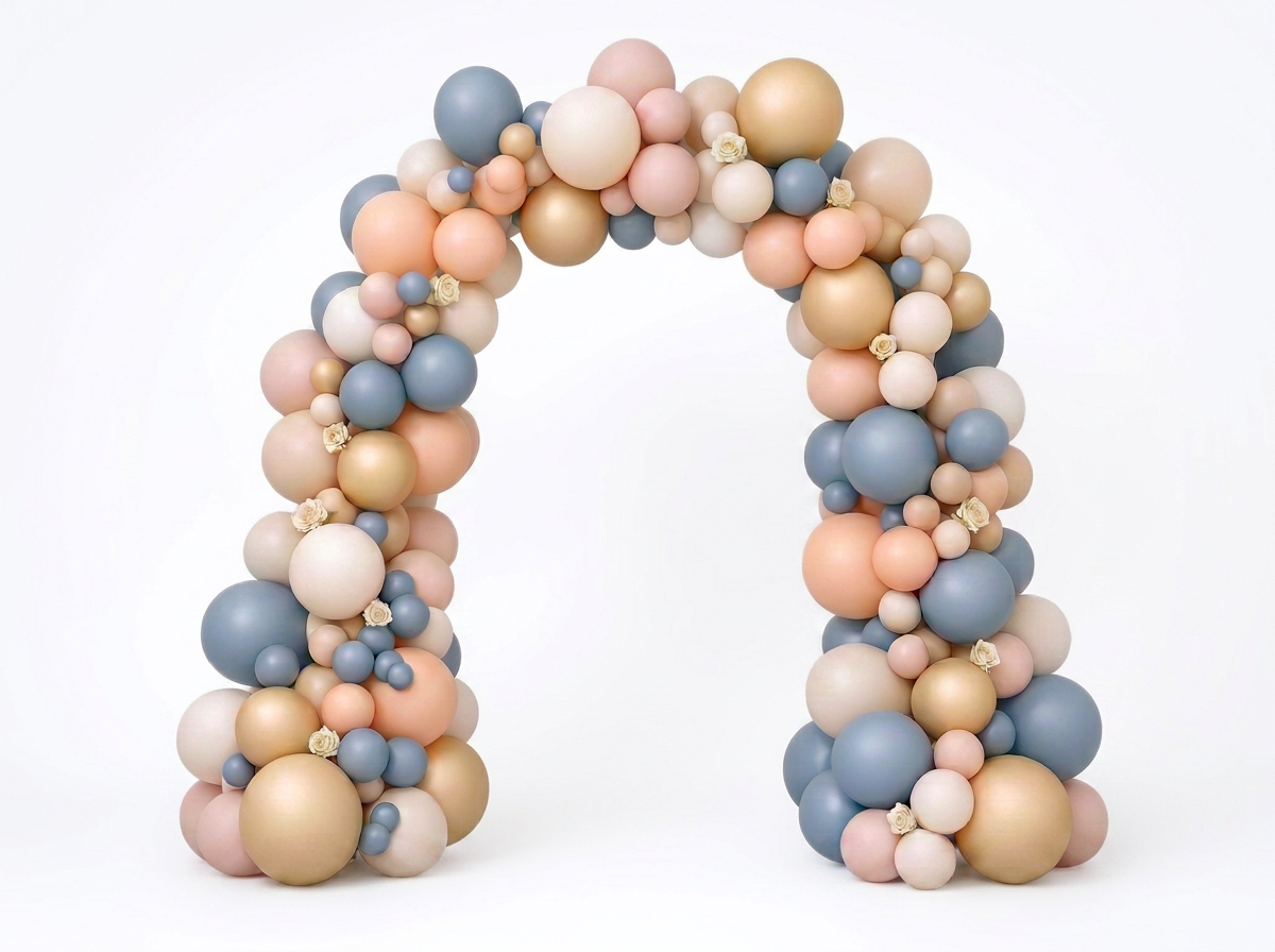 Front-facing dusty blue, peach, champagne and ivory balloon arch with minimal cream accents on a clean white studio background