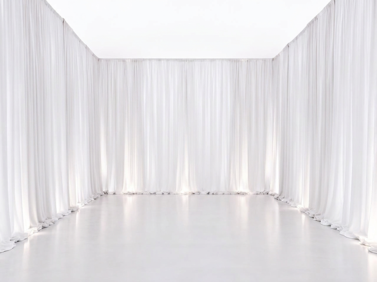Floor-to-ceiling white and ivory sheer fabric wall draping with soft vertical folds on a clean white studio background